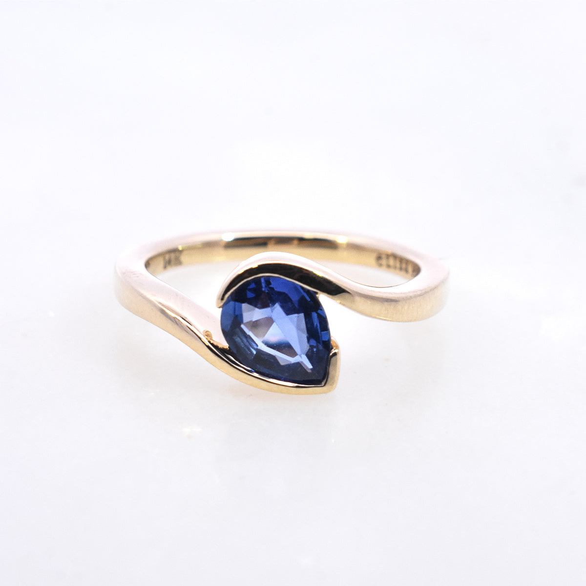 1.6ct Heirloom Pear Sapphire Sculptural Bezel Set on a Bypass Band