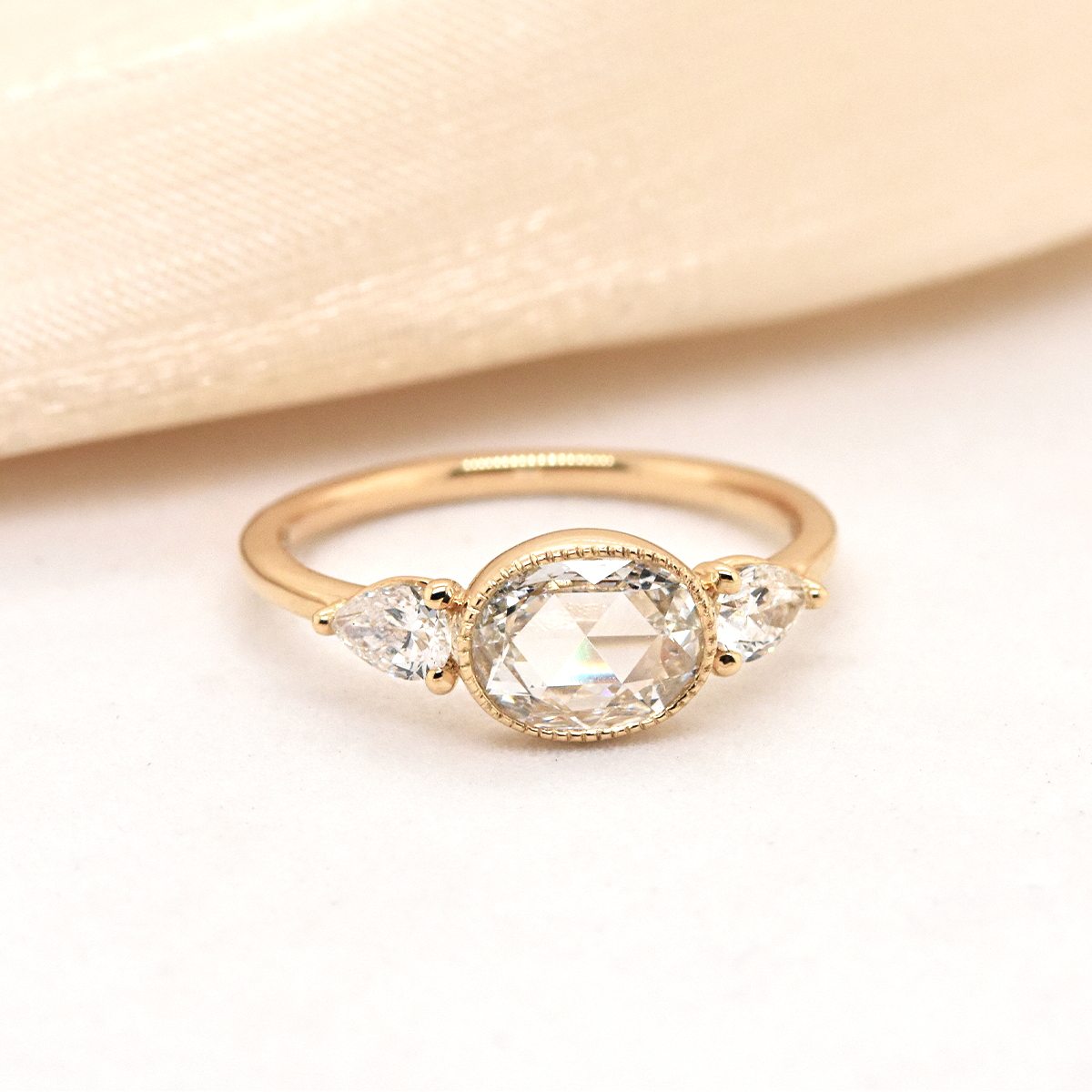.56ct Rose-Cut Oval Diamond Bezel Milgrain Set with Prong-Set Pear Accent Diamonds