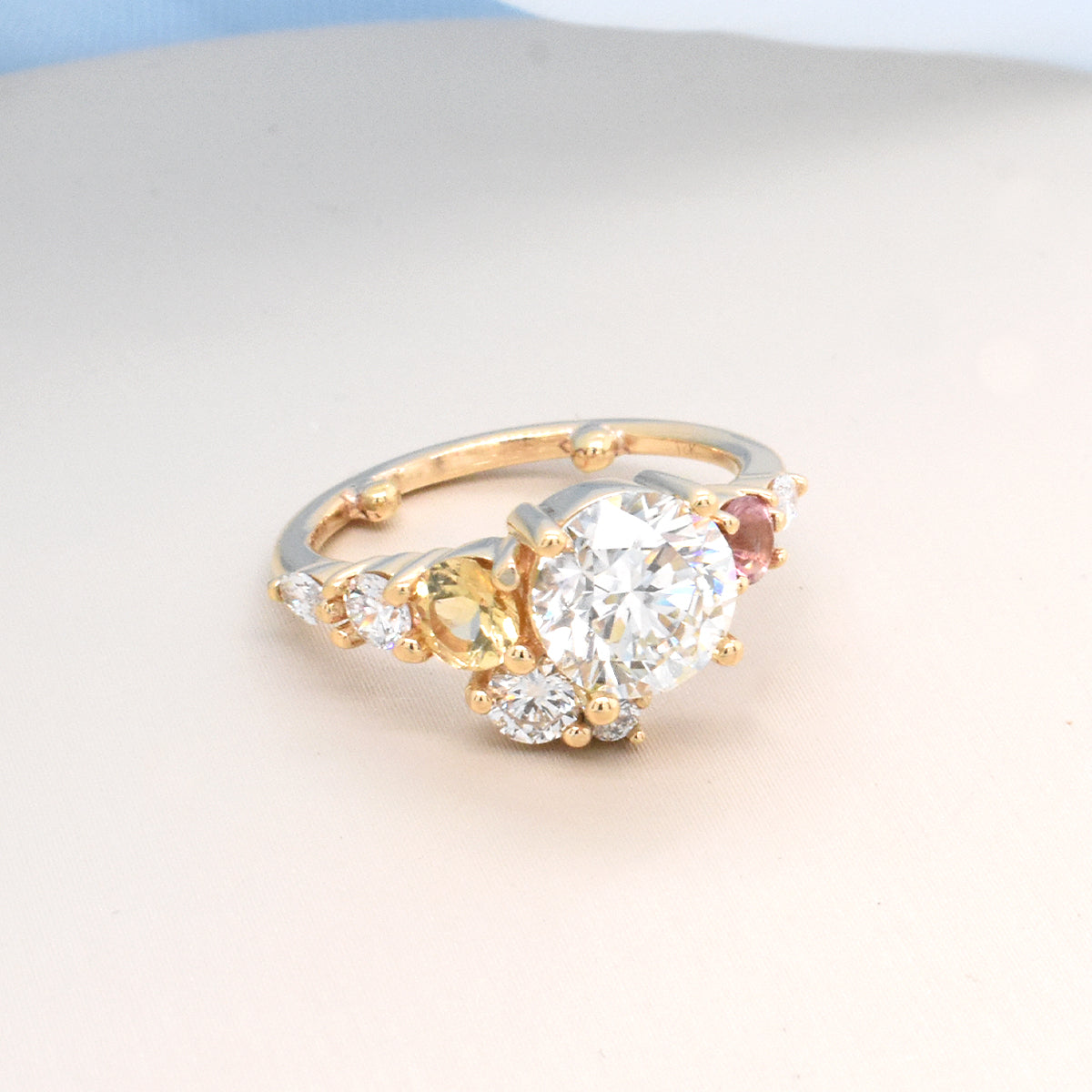 Round White diamond Featuring Off-set Marquise Diamonds, & Round Pink and Yellow Sapphires