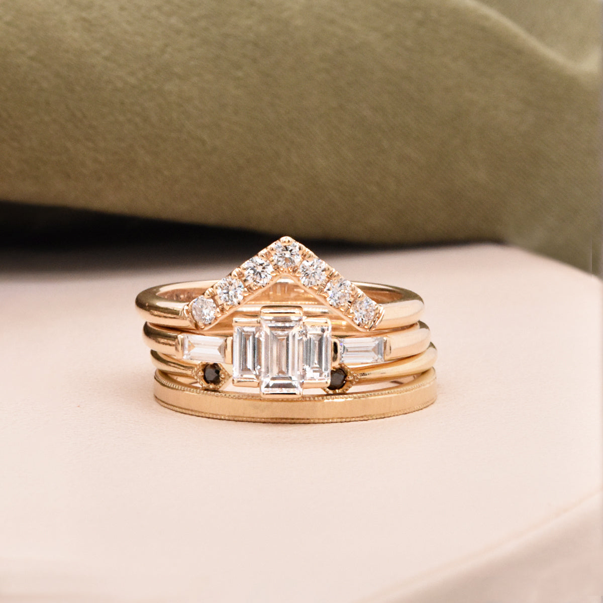 Graduating Diamond Baguette Center Stones with Side Baguette Accents, a Diamond Contour Band, Black Diamond Deco Cuff Ring, and a Matte Finish Milgrain Hammered Band