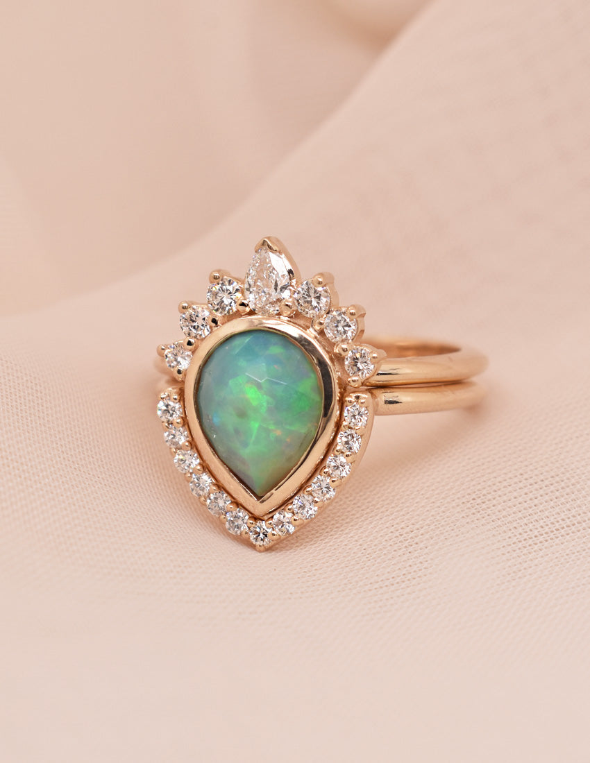 1.54ct Pear Opal in a Bezel-Set Half-Halo Ring with a Matching Half-Halo Band