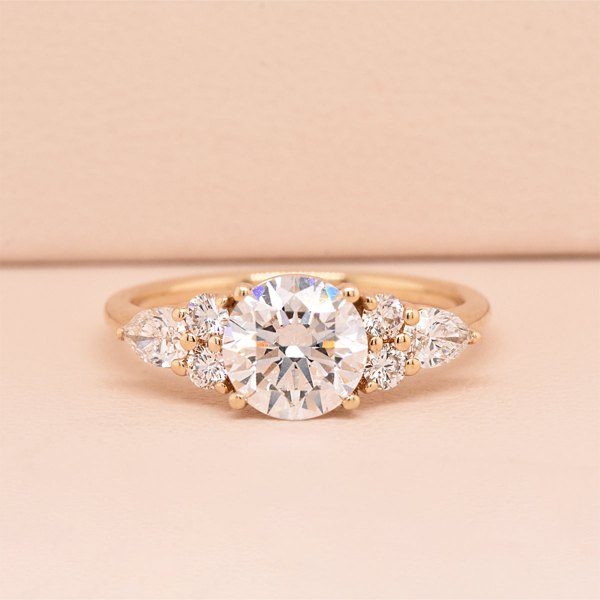1.3ct Brilliant Cut Round Diamond with 4 Round & 2 Pear Diamond Accents
